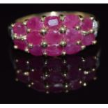 A 9ct gold ring set with 12 oval cut rubies and diamonds, 3g, size P