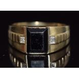 A 9ct gold ring set with diamonds and onyx, 3.4g, size U