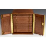 Peter Nichols mahogany coin collector's cabinet the twin doors opening to reveal 28 drawers with