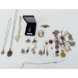 A collection of silver jewellery including bracelets, necklaces, pendants, cameo brooch, etc