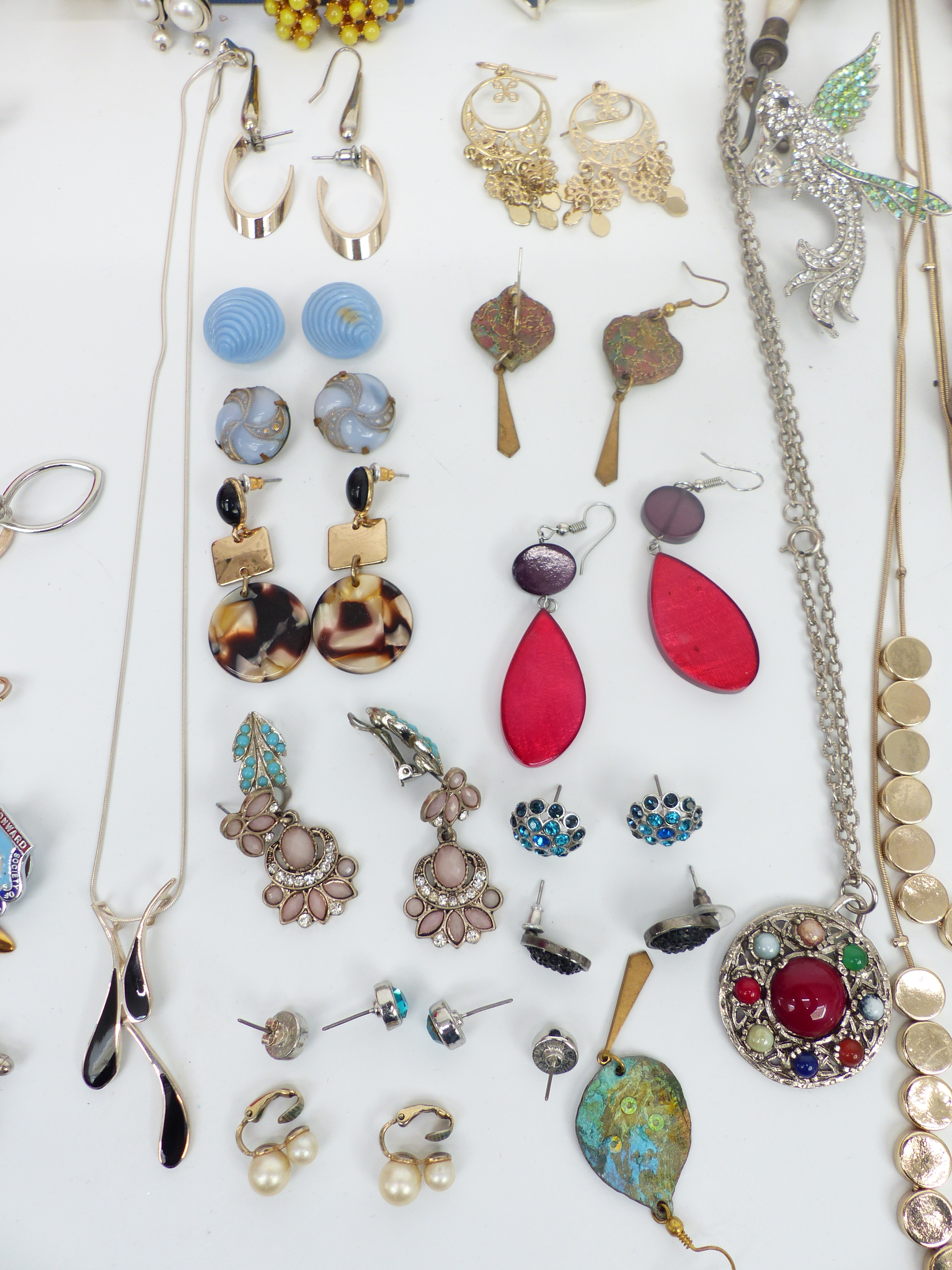 A collection of costume jewellery including necklaces, enamel and marcasite brooch, earrings, rolled - Image 3 of 4