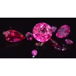 A loose cushion cut Burmese ruby, pear cut ruby, round cut synthetic ruby, small rubies and pink