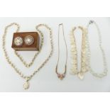 A collection of jewellery including two silver brooches set with mother of pearl, in wooden box,