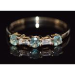 A 9ct gold ring set with round cut green sapphires and baguette cut white sapphires, 18g, size P/Q