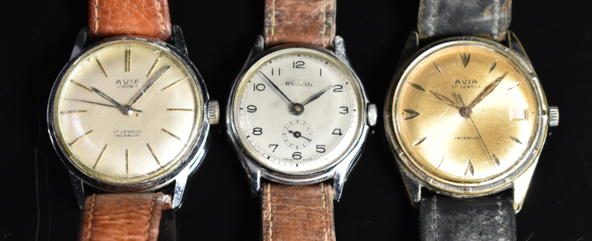 Three gentleman's wristwatches comprising, Avia Cadet, Rural and an Avia with date aperture, largest