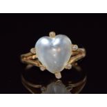 Victorian ring set with a heart cut moonstone cabochon surrounded by diamonds, size R, 5g