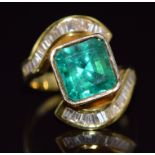 An 18ct gold ring set with a natural Colombian apple green emerald of approximately 5ct and 34