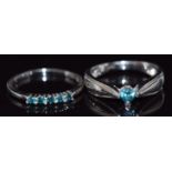 A 14k white gold ring set with five blue diamonds and a 9k gold ring set with a blue diamond