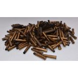 A collection of brass .303 rifle cartridge cases and clips.