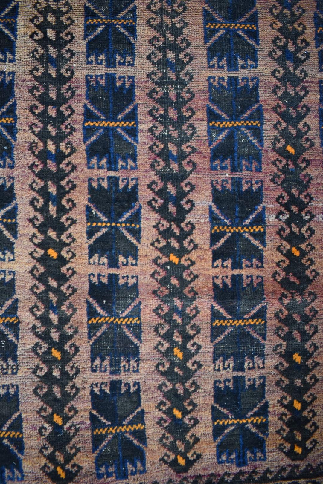 Turkoman rug with four rows of nine guls on a wine ground, 197 x 111cm - Image 3 of 3