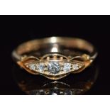An 18ct gold ring set with five diamonds, 2.8g, size M