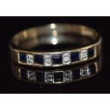 A 9ct gold ring set with alternating sapphires and diamonds, 1.9g, size P