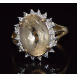 A 9ct gold ring set with an oval cut quartz, 4.1g, size O