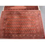 Turkoman rug and matching runner with multiple guls on a wine ground