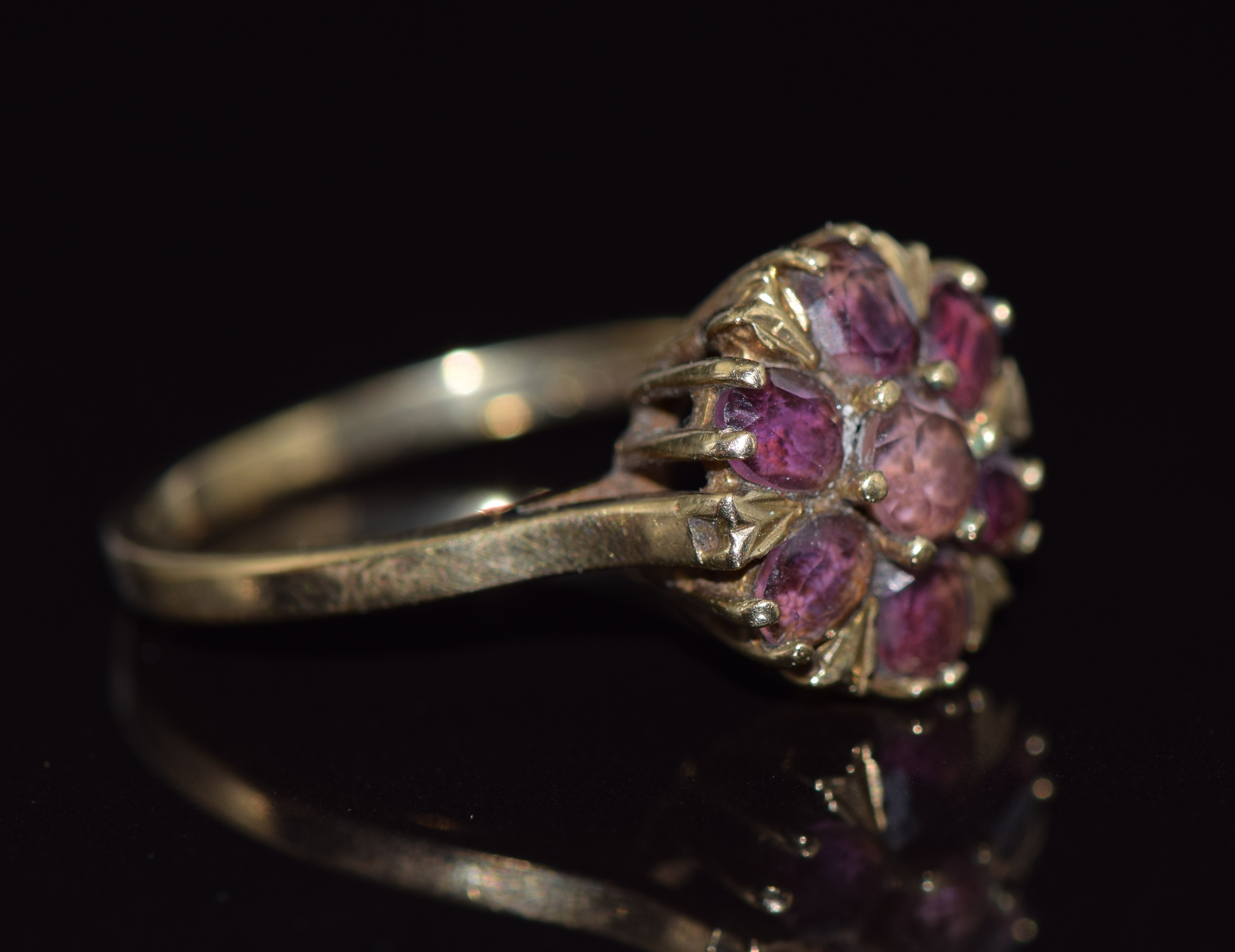 A 9ct gold ring set with a round and oval cut garnets in a cluster, 2.7g, size O - Image 2 of 2