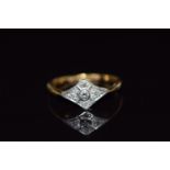 An 18ct gold ring set with diamonds in a platinum setting, 2.8g, size L