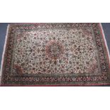 Persian rug with central floral cartouche within a floral border, 320 x 210cm, with a label for