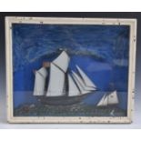 A 19thC diorama of two sailing ships, probably painted metal, in glazed case, 31x38cm