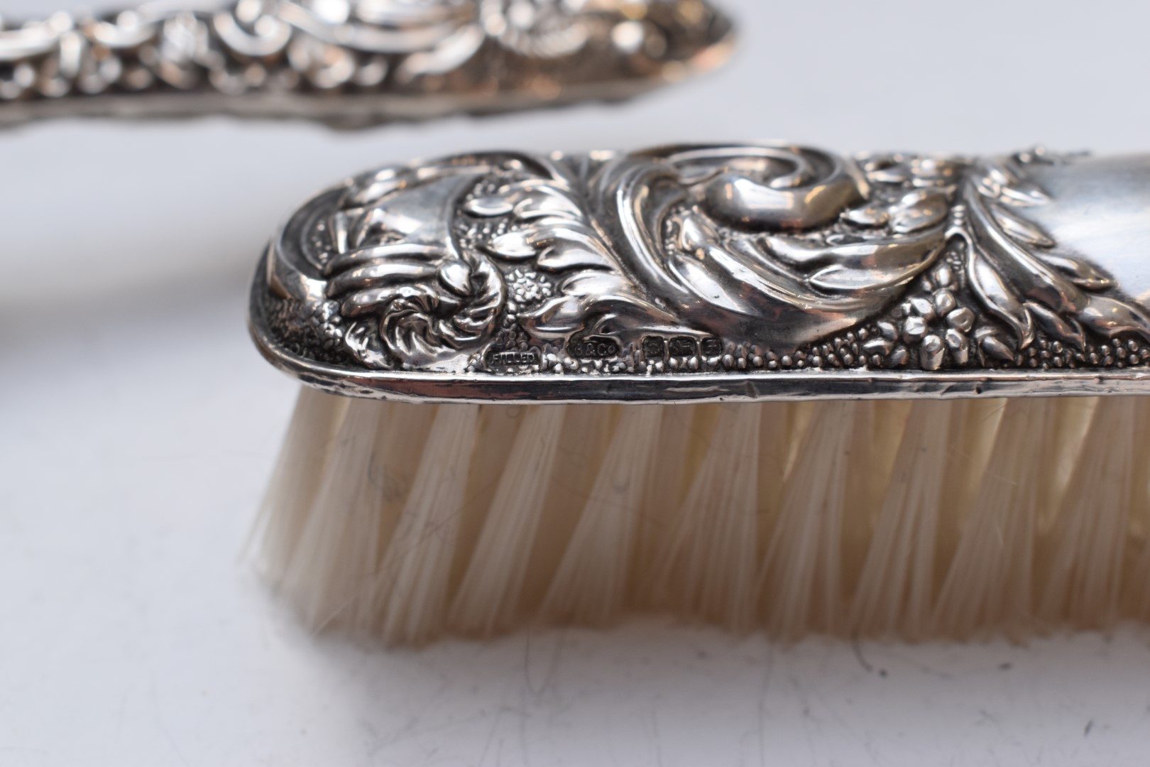 Hallmarked silver mounted dressing table items comprising hand mirror, two brushes and comb, - Image 5 of 8