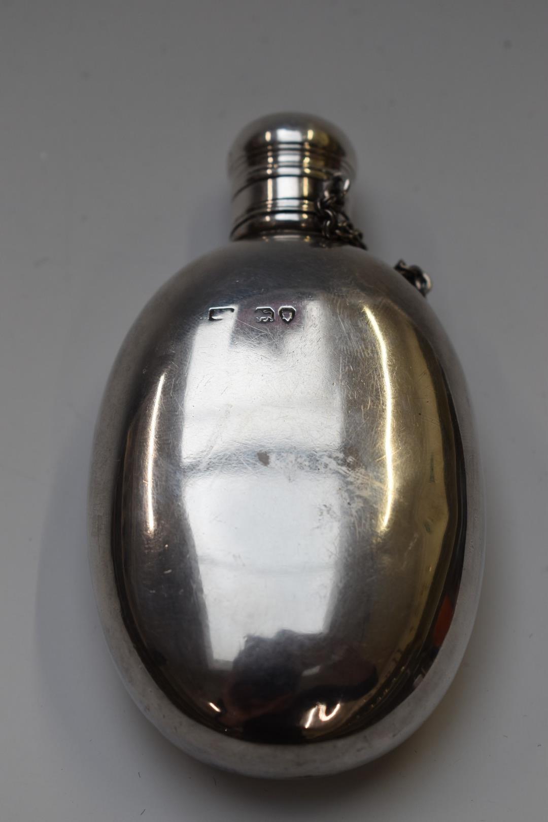 Victorian hallmarked silver oval hip or spirit flask with screw on lid retained by a chain, the body - Image 2 of 3
