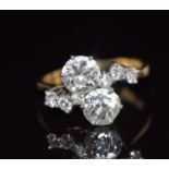 An 18ct gold ring set with two old cut diamonds each approximately 1.1ct with six further diamonds