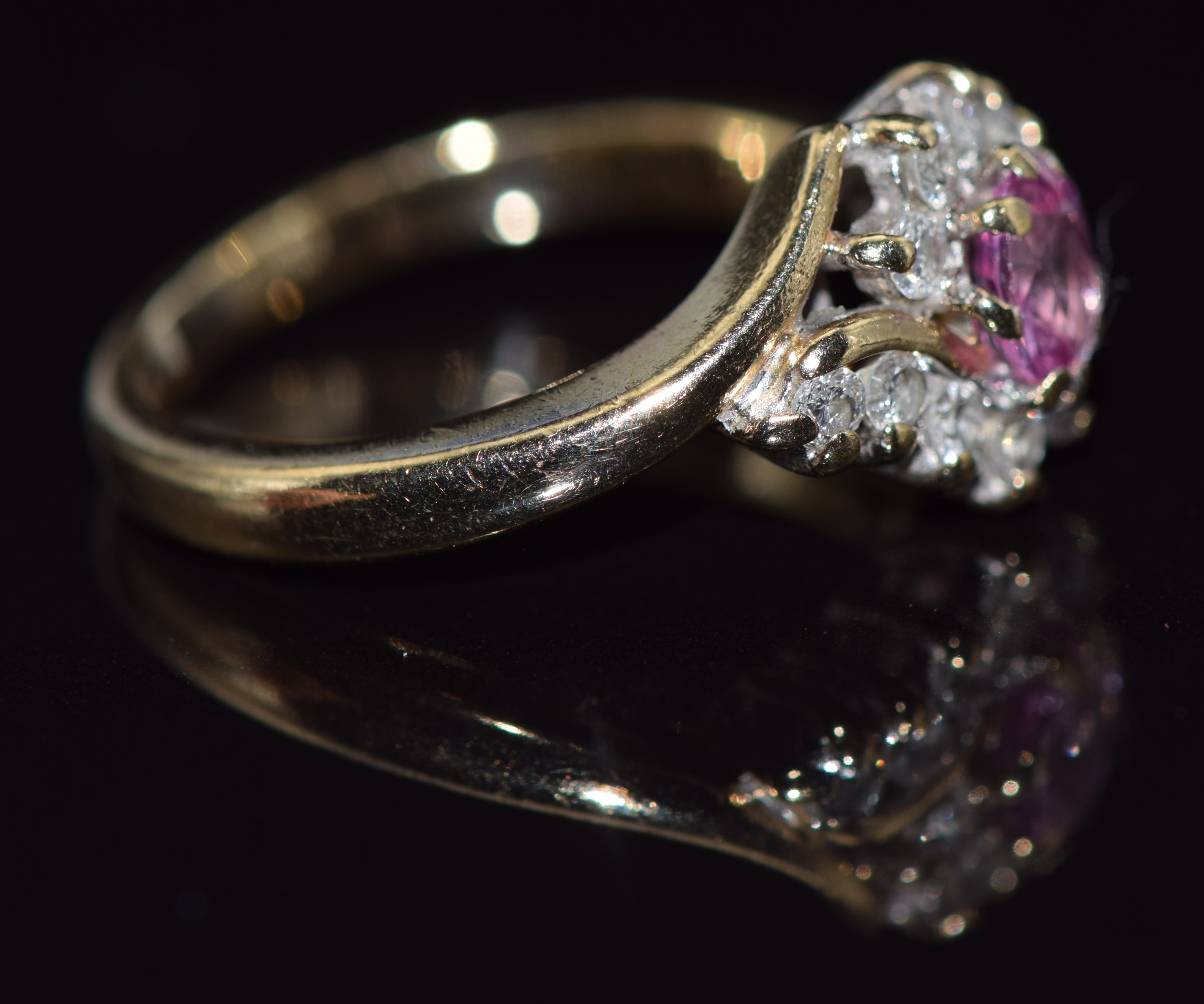 A 9ct gold ring set with an oval cut pink sapphire and diamonds, 3.6g, size K/L - Image 2 of 2