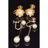 A pair of 9ct gold earrings set with a pearl to each, 1.9g and a pair of yellow metal earrings set