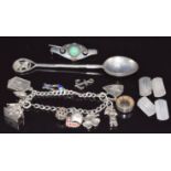 A pair of silver cufflinks, white metal brooch, silver charm bracelet etc