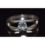 An 18ct white gold ring set with a round cut diamond of approximately 0.4ct, 4g, size L/M