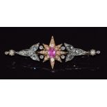 Victorian brooch set with an oval cut pink sapphire of approximately 0.5ct surrounded by rose cut