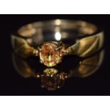 A 9ct gold ring set with a yellow sapphire of approximately 0.4cts, 2.7g, size N
