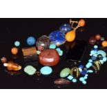 A collection of turquoise cabochons, lapis lazuli cabochon amber earring, etc