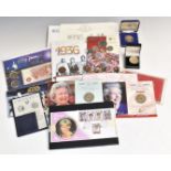 A collection of commemorative coin and stamp presentation packs, includes 1936 'Three Kings' example