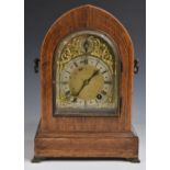 Winterhalder and Hoffmeier mitre cased mantel clock with brass spandreled dial and arch, silvered