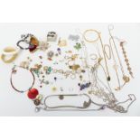 A collection of costume jewellery including necklaces, brooches, etc