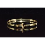 Tiffany & Co 18ct gold hook and eye bangle, 18.3g