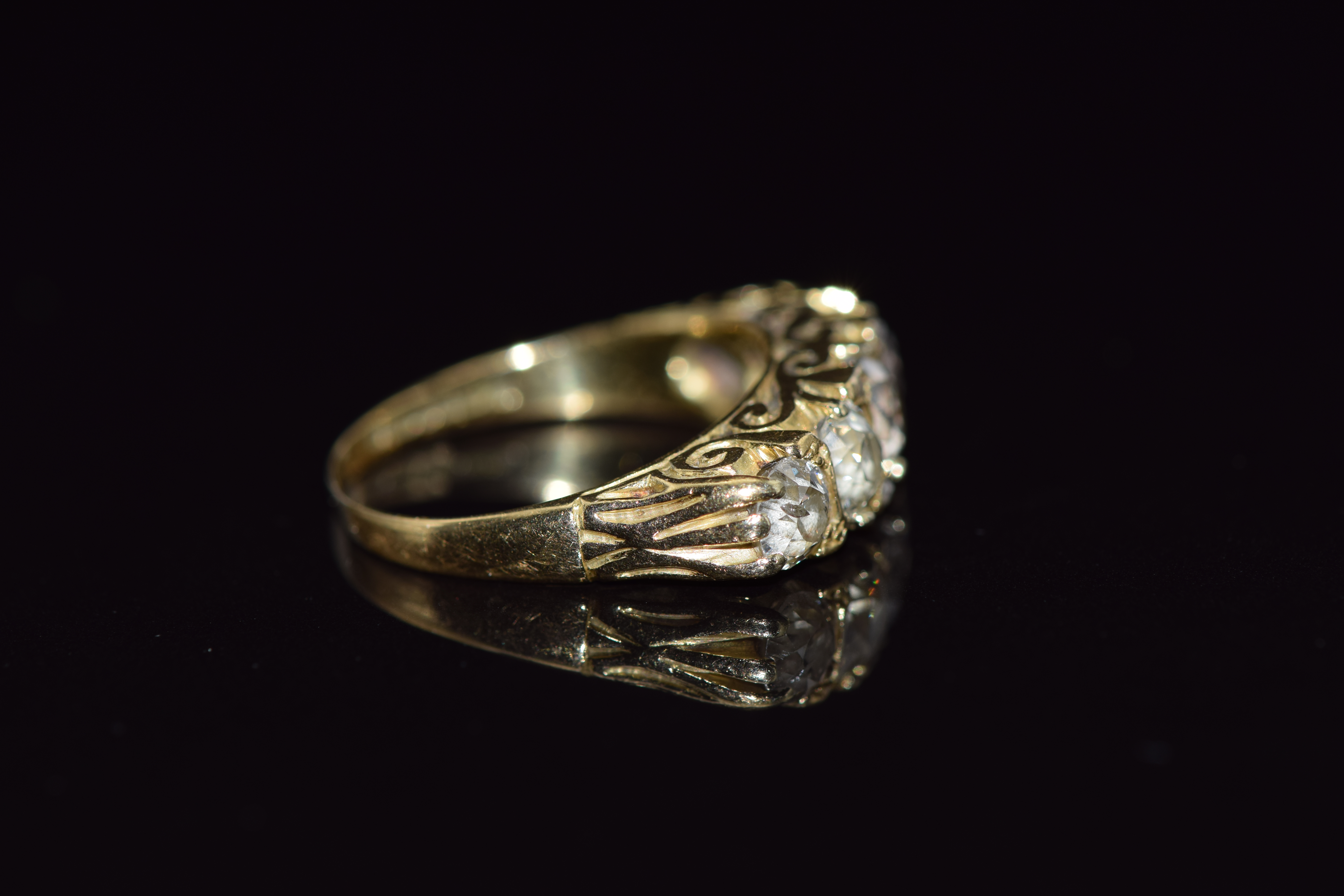 An 18ct gold ring set with five old cut diamonds measuring 0.65, 0.45, 0.45, 0.3ct & 0.3ct - Image 2 of 2