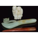 A Chinese jade carving of two boys, an agate paper knife, jade paper knife and a jadeite dragon