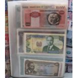 A collection of world banknotes contained in an album, mostly clean examples to include an
