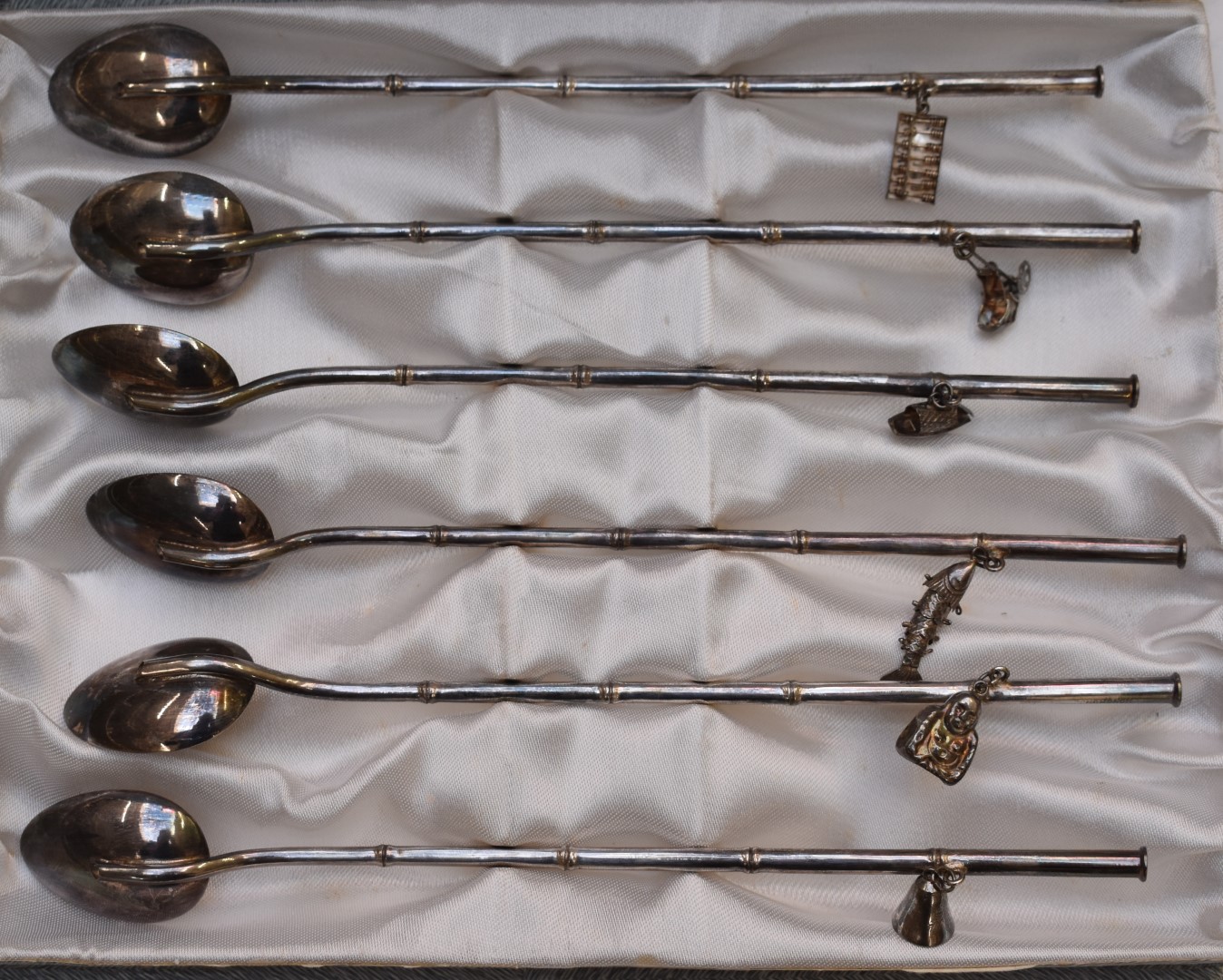 Set of six white metal sundae or ice cream spoons with Eastern charms hanging from the handles, each - Image 2 of 3