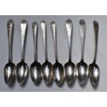 Eight Georgian Irish hallmarked silver dessert spoons with bright cut decoration, three Dublin circa