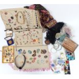 A collection of costume jewellery including beads, enamel copper pendants, large silver necklace,