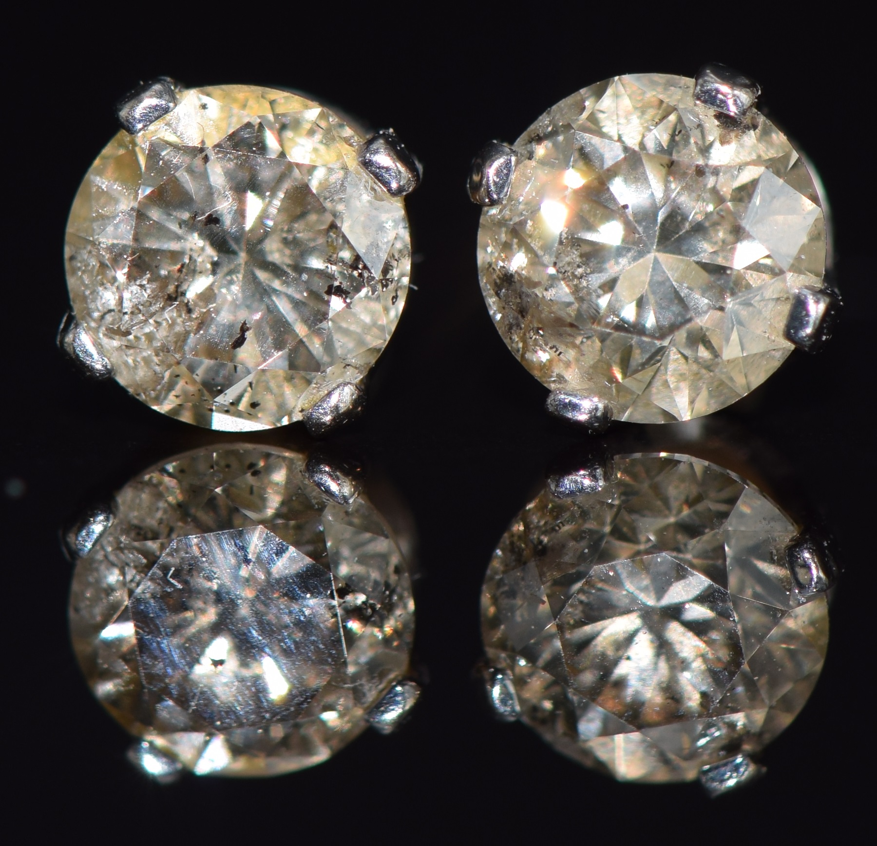 A pair of white metal stud earrings set with a round cut diamond of approximately 0.3ct to each, 0. - Image 2 of 2