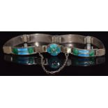 A hallmarked silver bracelet set with green and blue enamel, Birmingham 1910, maker J.F