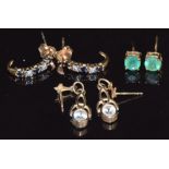 A pair of 9ct gold earrings set with an emerald to each, a pair of 9ct gold earrings set with