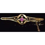 A 9ct gold brooch set with a tourmaline and seed pearls, 2.9g, 4.5cm long