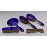 George V hallmarked silver and blue guilloché enamel dressing table set comprising hand mirror and