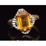 A 9ct gold ring set with an emerald cut citrine, 3.5g, size N