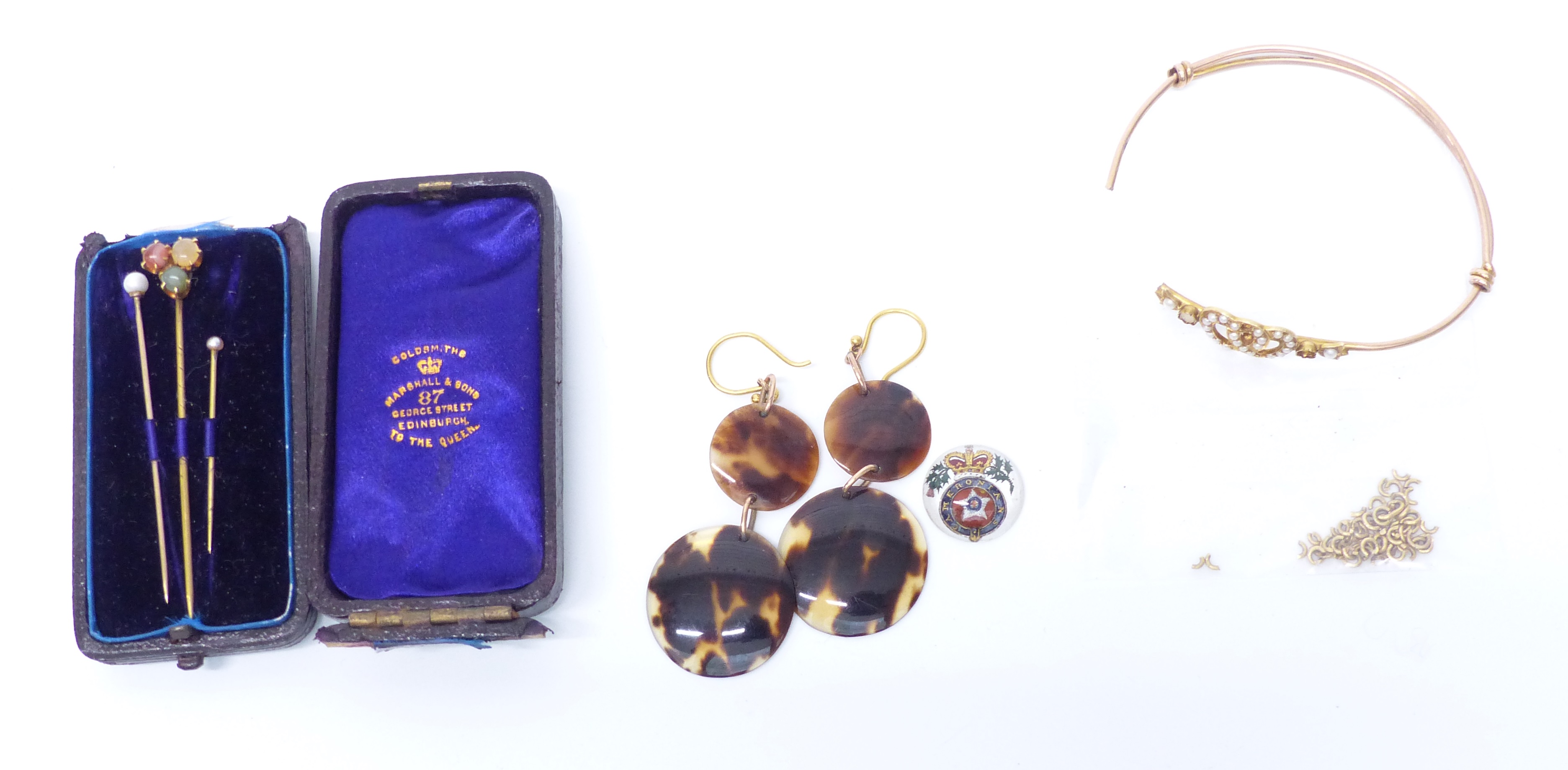 A pair of tortoiseshell earrings, Essex Crystal cabochon, three stick pins and a section of yellow