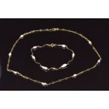 A 9ct gold necklace set with pearls and a similar bracelet, 4.9g